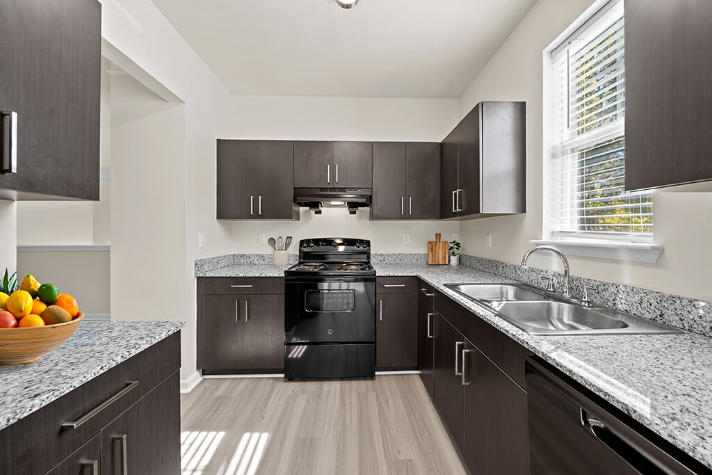 Kitchen with plenty of cabinets at Grand Oaks Apartments in Chester VA
